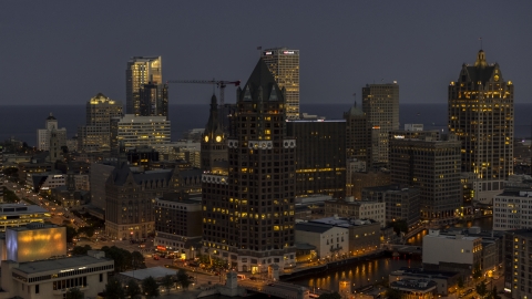 DXP002_151_0001 - Aerial stock photo of A riverfront office tower at night, Downtown Milwaukee, Wisconsin