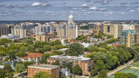 DXP002_158_0002 - Aerial stock photo of A view of apartment buildings near the capitol dome in Madison, Wisconsin