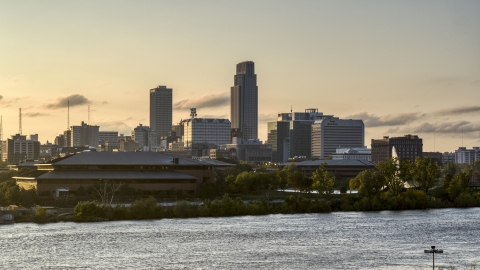 DXP002_172_0006 - Aerial stock photo of The skyline at sunset, seen from the river, Downtown Omaha, Nebraska