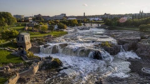 DXP002_176_0009 - Aerial stock photo of The waterfalls on Big Sioux River at sunset in Sioux Falls, South Dakota