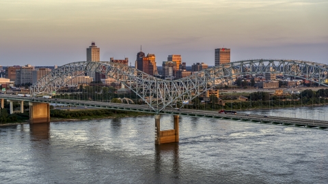 DXP002_181_0003 - Aerial stock photo of The city's skyline as traffic crosses the bridge at sunset, Downtown Memphis, Tennessee