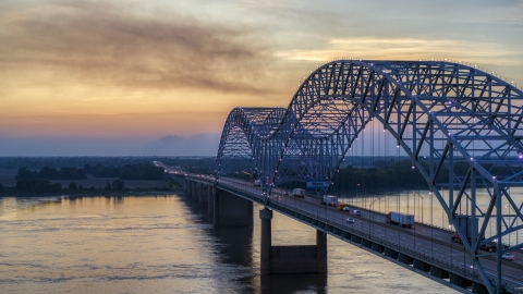 DXP002_181_0005 - Aerial stock photo of The Hernando de Soto Bridge at sunset, Arkansas