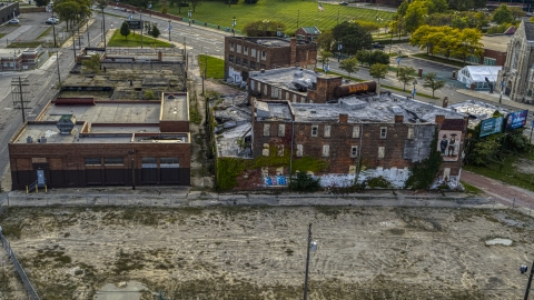 DXP002_192_0003 - Aerial stock photo of Abandoned building and lot at sunset, Detroit, Michigan