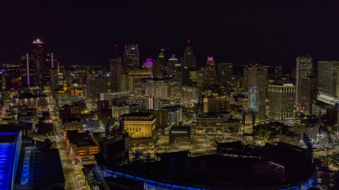 DXP002_193_0014 - Aerial stock photo of The city's skyline and baseball stadium at night, Downtown Detroit, Michigan