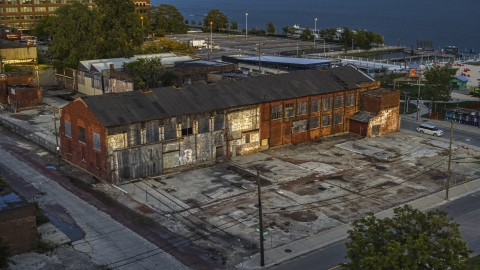 DXP002_197_0002 - Aerial stock photo of An abandoned Northern Cranes factory building at sunset, Detroit, Michigan