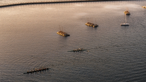 DXP002_203_0010 - Aerial stock photo of Two rowboats on Lake Erie at sunset, Buffalo, New York