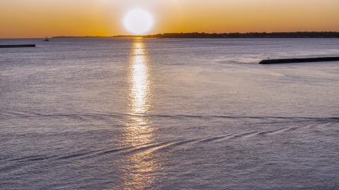 DXP002_204_0006 - Aerial stock photo of The setting sun over Lake Erie, Buffalo, New York