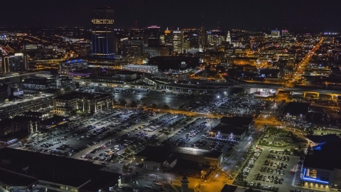DXP002_205_0002 - Aerial stock photo of The skyline at night seen from arena parking lots, Downtown Buffalo, New York