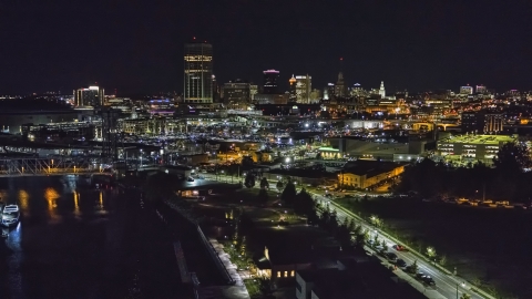 DXP002_205_0003 - Aerial stock photo of The skyline seen from the river at night, Downtown Buffalo, New York