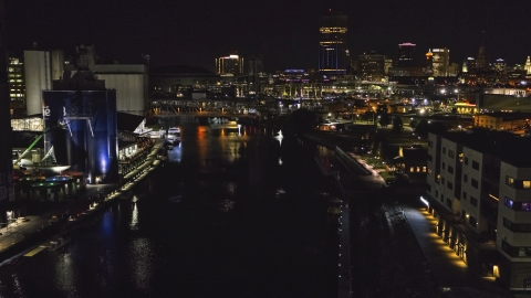 DXP002_205_0006 - Aerial stock photo of A view of the river toward the downtown skyline at night, Downtown Buffalo, New York