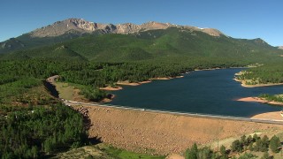 AF0001_000087 - HD stock footage aerial video tilt from the dam at Crystal Creek Reservoir to reveal Pikes Peak, Colorado