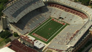 AF0001_000110 - HD aerial stock footage approach and orbit Texas Memorial Stadium in Austin, Texas