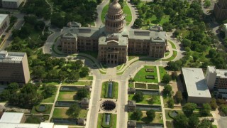 AF0001_000113 - HD aerial stock footage bird's eye view of University of Texas and streets leading to reveal of Texas State Capitol, Downtown Austin, Texas