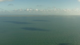 AF0001_000169 - HD aerial stock footage fly over the Gulf of Mexico to approach the Matagorda Peninsula, Texas