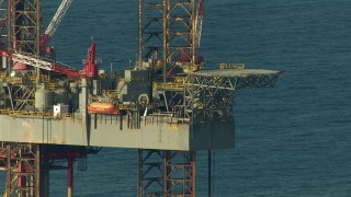 AF0001_000183 - HD aerial stock footage flyby an oil derrick in the Gulf of Mexico