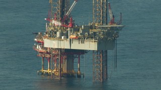AF0001_000184 - HD aerial stock footage of an offshore oil rig in the Gulf of Mexico