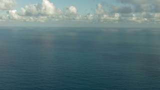 AF0001_000187 - HD stock footage aerial video flyby open sea beneath low clouds in the Gulf of Mexico