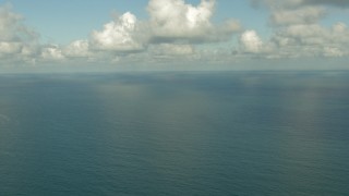 AF0001_000189 - HD aerial stock footage flyby the open sea in the Gulf of Mexico with clouds overhead