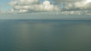 AF0001_000193 - HD aerial stock footage of the Gulf of Mexico beneath clouds and coastline in the distance, Matagorda Peninsula, Texas
