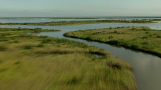 AF0001_000199 - HD aerial stock footage of flying low over marsh and wetland on the Matagorda Peninsula, Texas