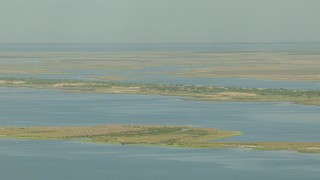 AF0001_000202 - HD aerial stock footage of flying by wetlands on Matagorda Bay, Texas