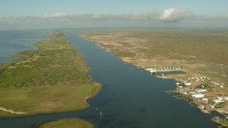 AF0001_000203 - HD aerial stock footage of passing waterfront homes with docks on Matagorda Bay, Matagorda Country, Texas