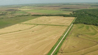 AF0001_000229 - HD aerial stock footage of passing farm fields in Wharton County, Texas
