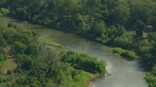 AF0001_000230 - HD aerial stock footage of a bend in a river through the countryside in Wharton County, Texas
