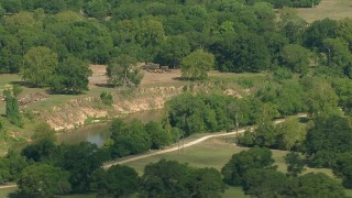 AF0001_000231 - HD aerial stock footage flyby a river through the countryside in Wharton County, Texas