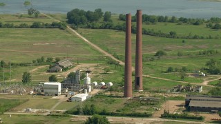 AF0001_000234 - HD stock footage aerial video orbit the smoke stacks at the Wharton County Generation power plant in Newgulf, Texas