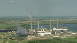 AF0001_000244 - HD stock footage aerial video of a reverse view of the lakeside power plant by Smithers Lake, Texas