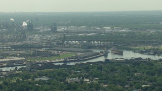 AF0001_000275 - HD stock footage aerial video flyby warehouses by the Buffalo Bayou, the 610 bridge, and an oil refinery in Harrisburg, Manchester, Texas
