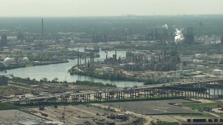AF0001_000277 - HD aerial stock footage of 610 Bridge spanning Buffalo Bayou near an oil refinery in Harrisburg, Manchester, Texas