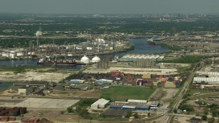 AF0001_000285 - HD stock footage aerial video pan across oil refineries and the 610 Bridge spanning Buffalo Bayou in Galena Park, Texas