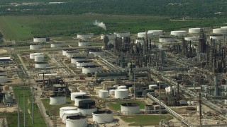 AF0001_000289 - HD stock footage aerial video of flying by an oil refinery and storage tanks in Galena Park, Texas