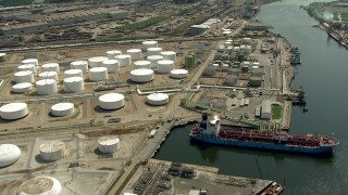 AF0001_000291 - HD stock footage aerial video fly over oil tanker and storage tanks to view the Buffalo Bayou, Pasadena, Texas