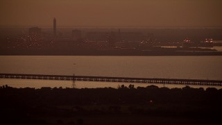 AF0001_000316 - HD aerial stock footage of Alcoa Aluminum Plant across Lavaca Bay at sunrise, Point Comfort, Texas