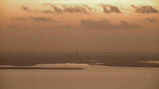 AF0001_000319 - HD aerial stock footage of Alcoa Aluminum Plant across Lavaca Bay, Point Comfort, Texas, sunrise
