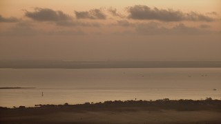 AF0001_000321 - HD aerial stock footage of boats in Lavaca Bay at sunrise, Texas