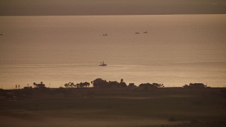AF0001_000322 - HD aerial stock footage of a boat in Lavaca Bay at sunrise, Texas