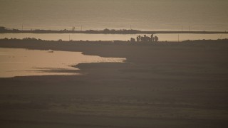 AF0001_000326 - HD aerial stock footage of marshland on the shore of Matagorda Bay, Texas, sunrise