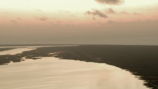 AF0001_000335 - HD aerial stock footage flyby marshland between the Gulf of Mexico and Espiritu Santo Bay, Texas, sunrise