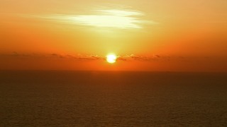 AF0001_000342 - HD aerial stock footage of a bright sunrise over the Gulf of Mexico