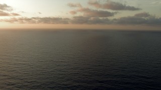 AF0001_000350 - HD aerial stock footage fly low over the sea at sunrise, Gulf of Mexico