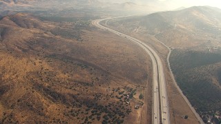 AF0001_000386 - HD stock footage aerial video flyby light traffic on 14 Freeway past Agua Dulce, California