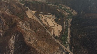 AF0001_000408 - HD aerial stock footage bird's eye view of a ranch by Big Tujunga Canyon Road, reveal homes by the creek, Tujunga, California