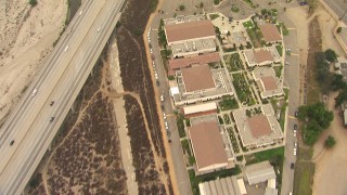 AF0001_000414 - HD aerial stock footage of bird's eye view of All Nations Church and the 210 Freeway, reveal greenhouses in Lake View Terrace, California