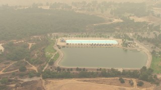 AF0001_000416 - HD aerial stock footage of the Hansen Dam Aquatic Center in Lake View Terrace, California
