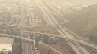AF0001_000418 - HD aerial stock footage of light traffic on the 210 / 118 Freeway interchange in Pacoima, California