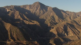 AF0001_000485 - HD aerial stock footage approach a rugged peak in the San Gabriel Mountains, California